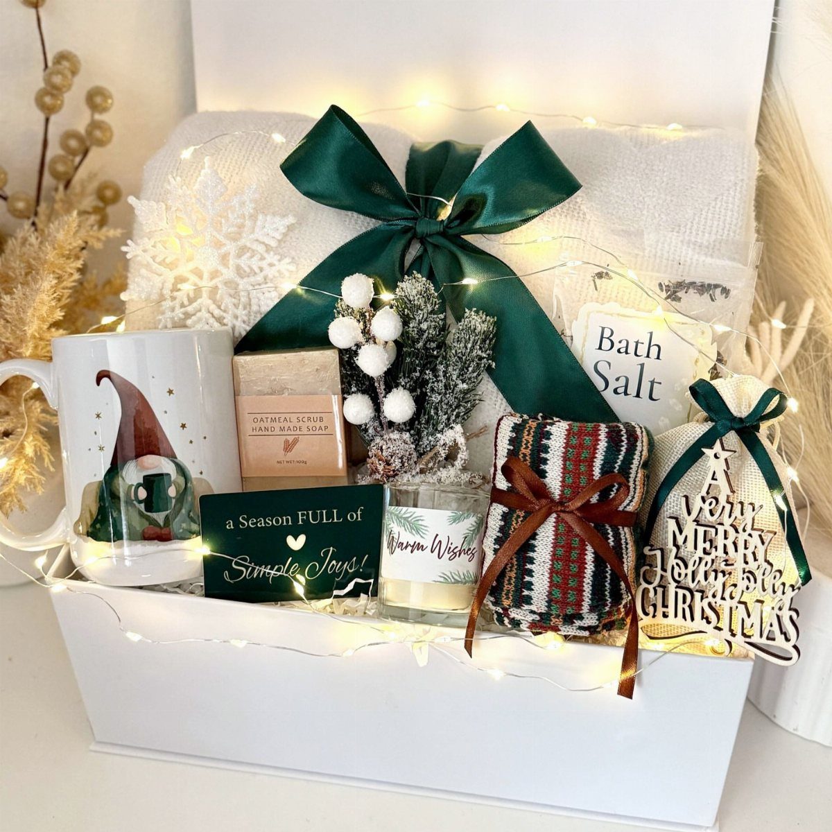 Holiday artisan gift box with gnome mug, bath products, and festive decorations.