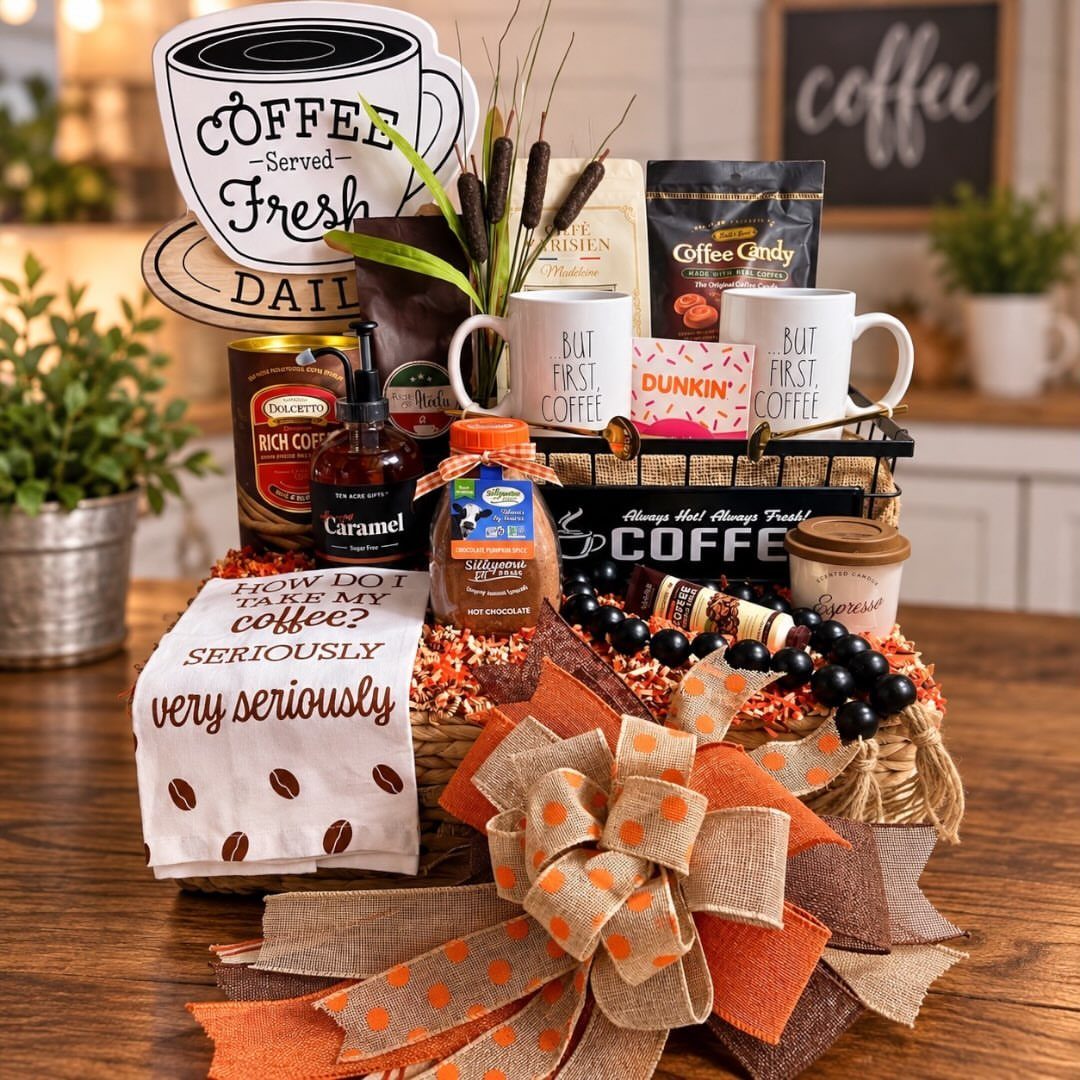 Coffee lovers gift basket with mugs, coffee beans, and a large orange bow.