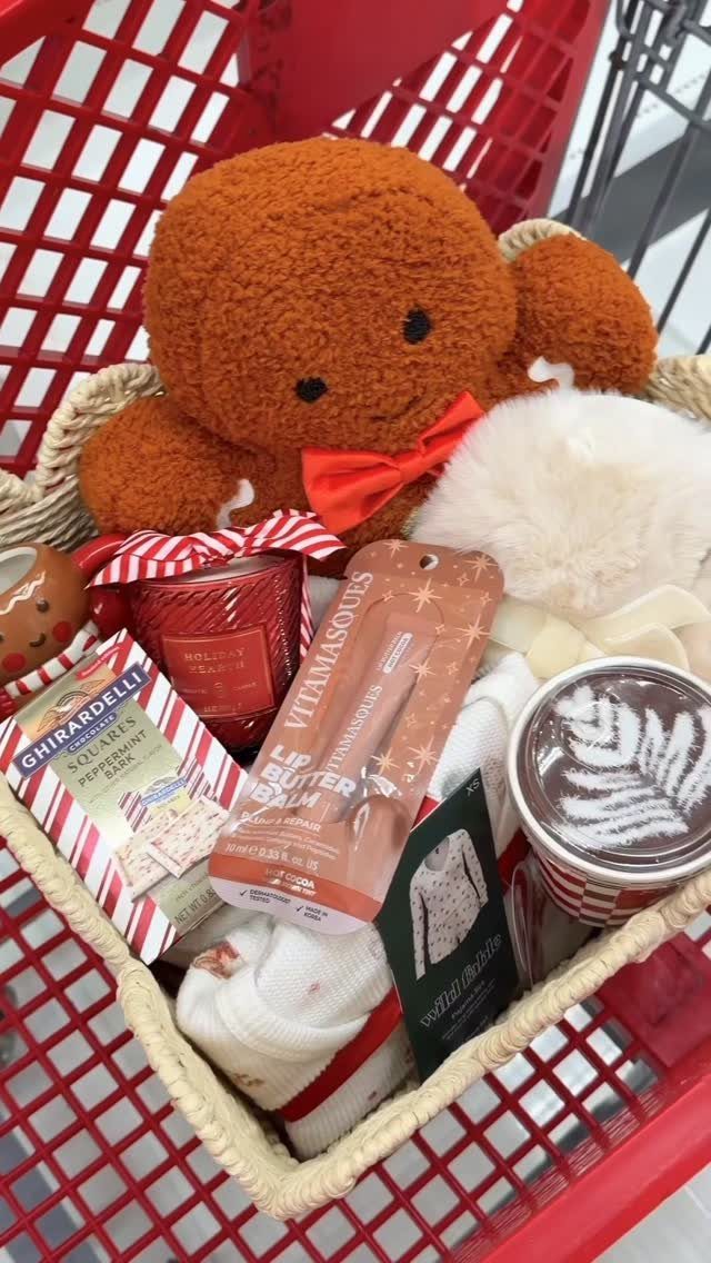 Woven gift basket with teddy bear, chocolates, and coffee in a red cart