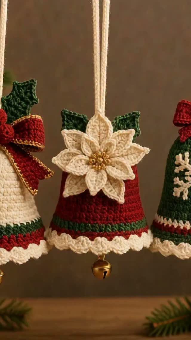 Crocheted Christmas bell ornaments in red and green with a white flower detail.