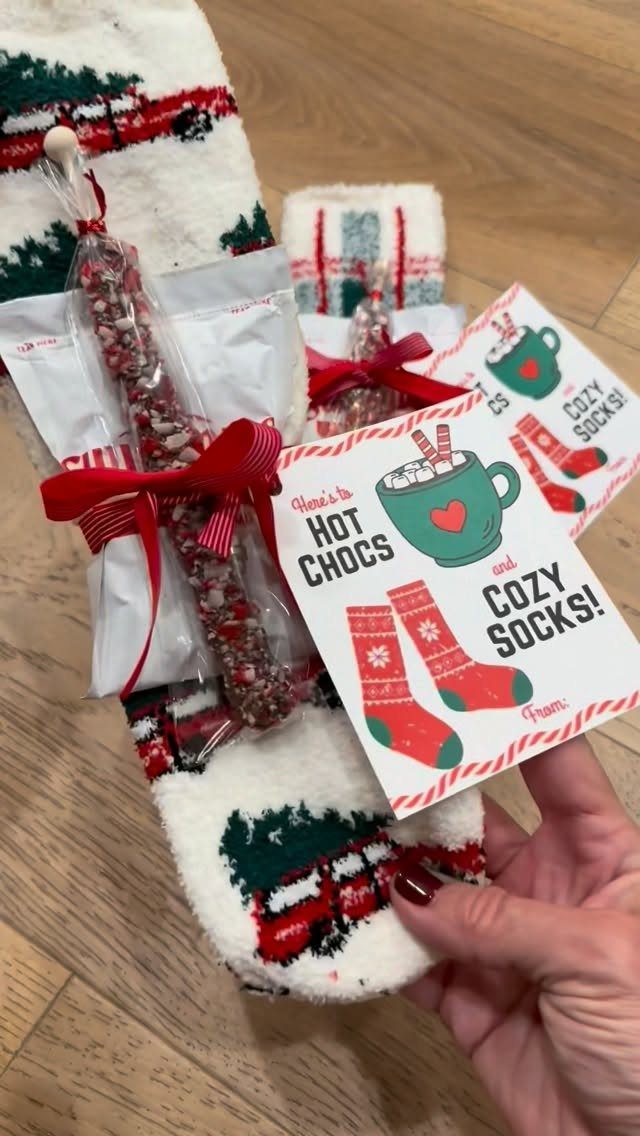 Christmas stocking gift set with hot cocoa mix and a themed gift tag.