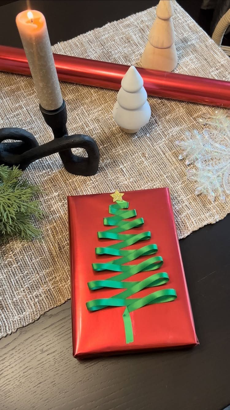 9 Christmas Gift Ribbon Ideas for Pretty Wrapped Presents 5 Red wrapped gift with green ribbon shaped like a Christmas tree on burlap