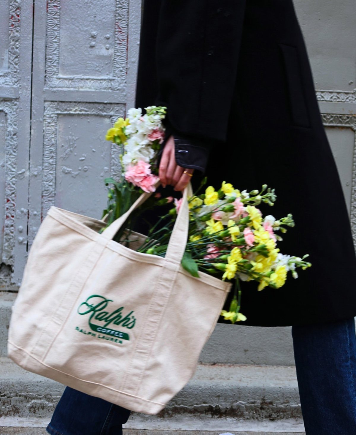 15 Coffee Drinker Gifts: Candles, Mugs, Roasters and More 9 Cream canvas tote bag with Ralph's Coffee logo filled with colorful spring flowers.