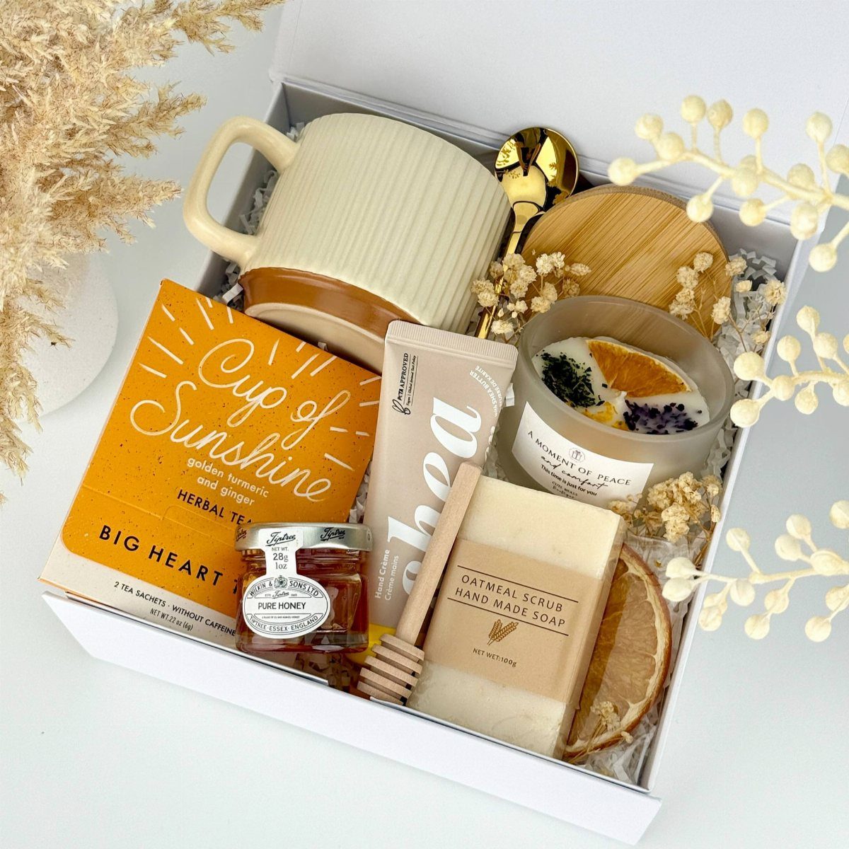Comfort Gift Basket Ideas for Rough Days: 9 Picks 7 Gift box with herbal tea, honey jar, ribbed mug, and handmade soap.