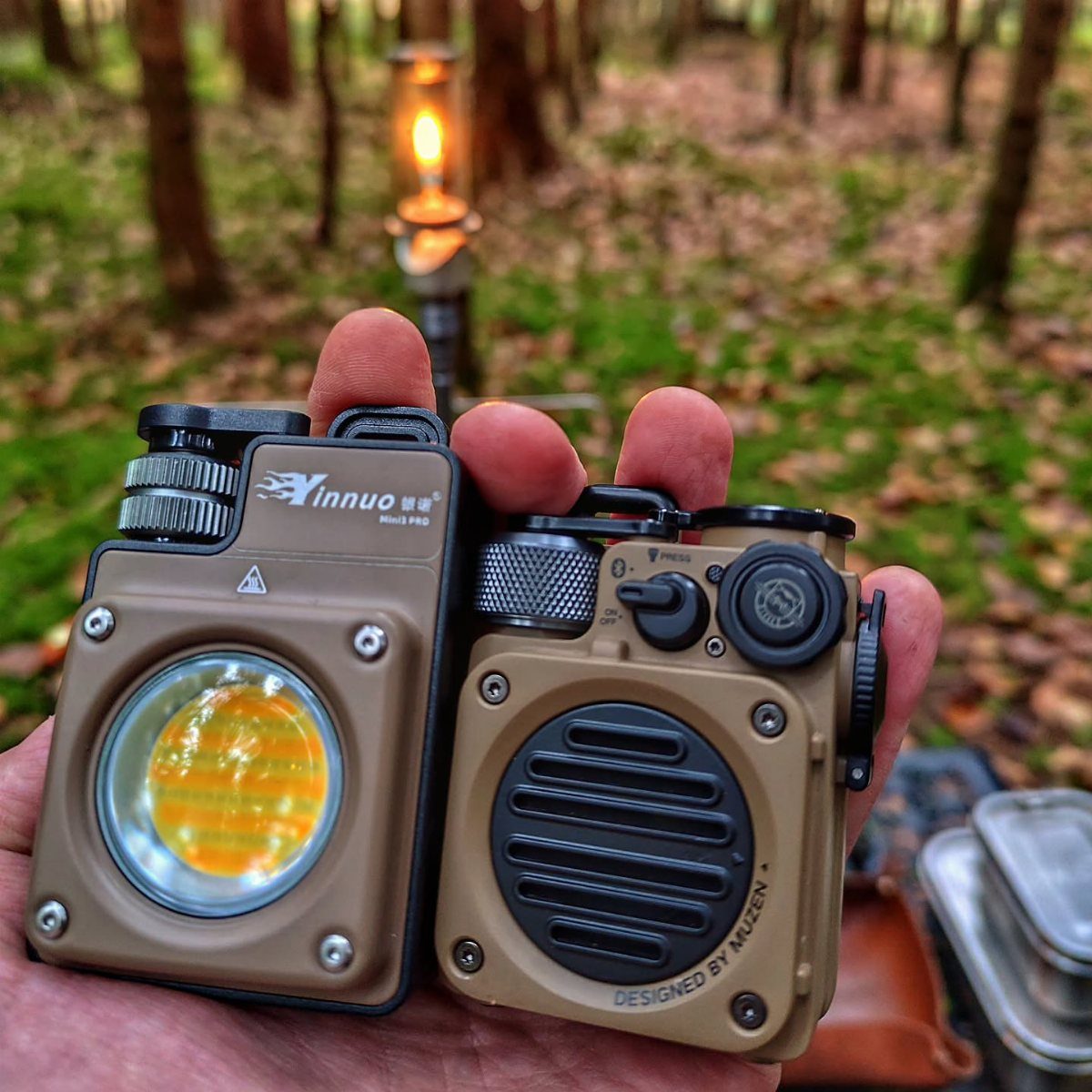 21 Cool Gifts for Adults: Practical Picks for 2026 15 Two tan outdoor gadgets, a flashlight and a radio, held in a hand.
