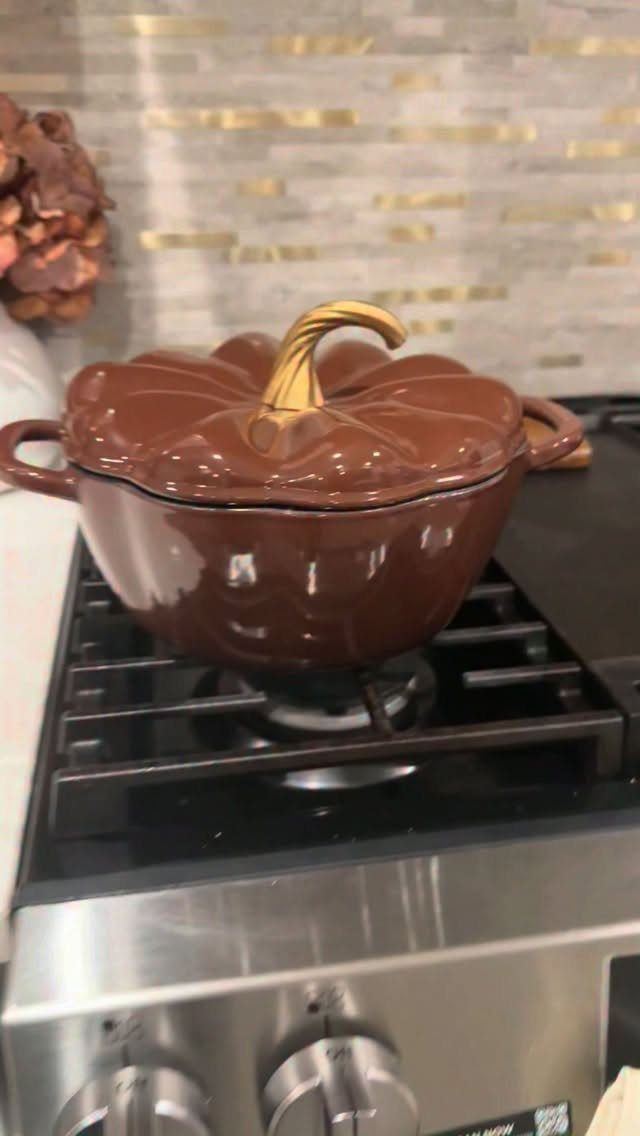 21 Cool Gifts for Adults: Practical Picks for 2026 13 Pumpkin-shaped brown enamel cast iron pot on a modern gas stovetop.