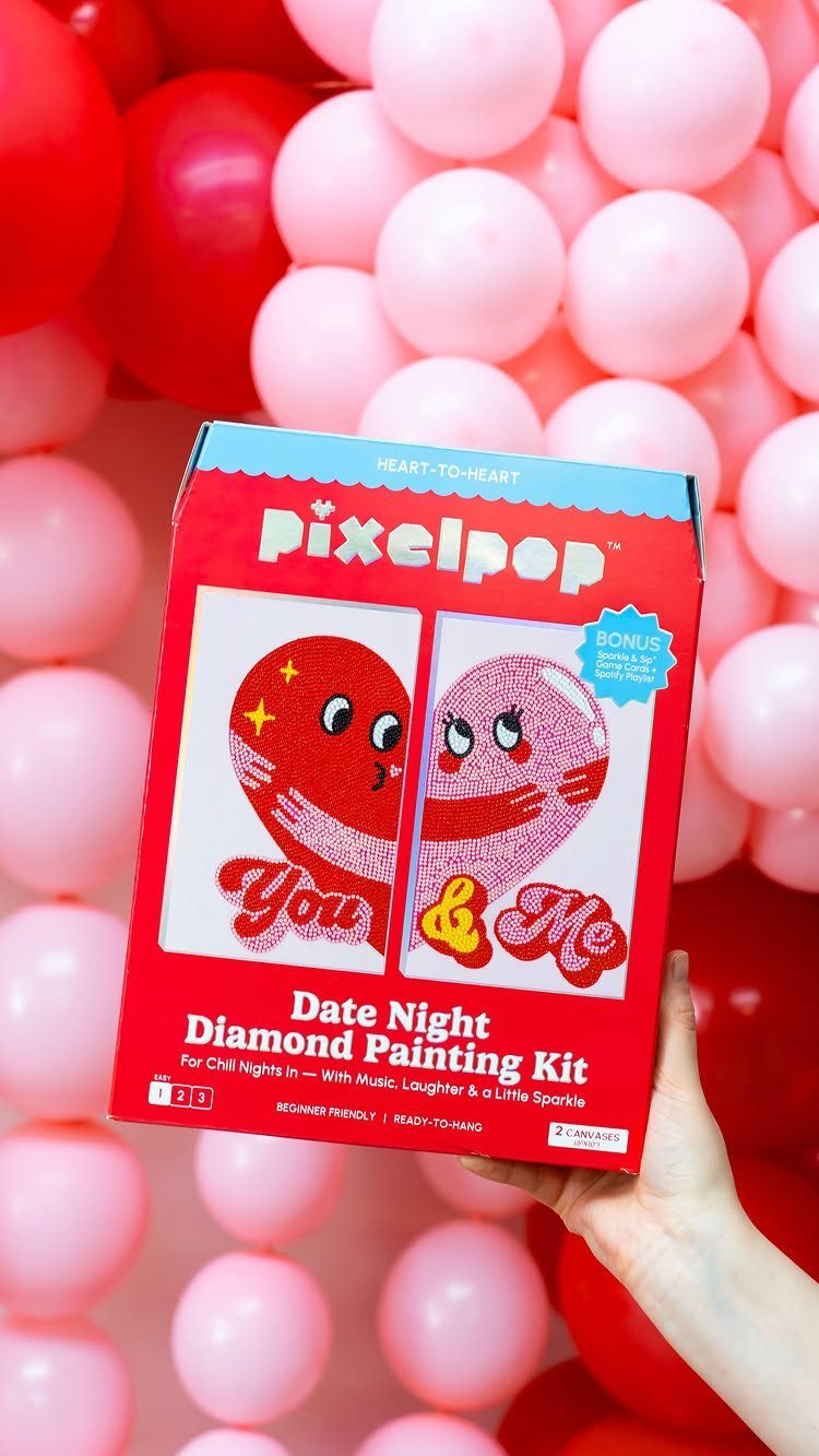 Date Night Diamond Painting Kit box held against a backdrop of pink balloons