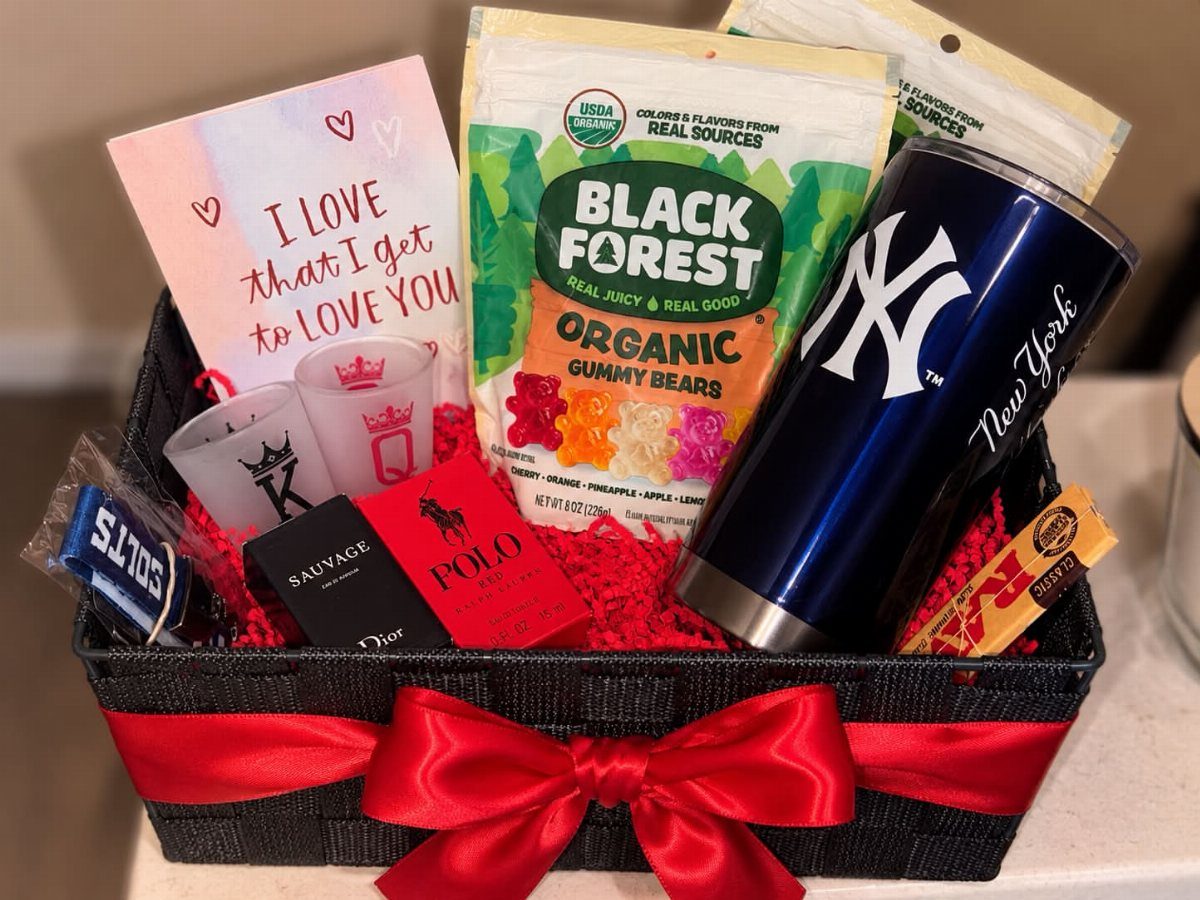 Gift basket with Yankees tumbler, cologne, gummy bears, and a romantic love card.