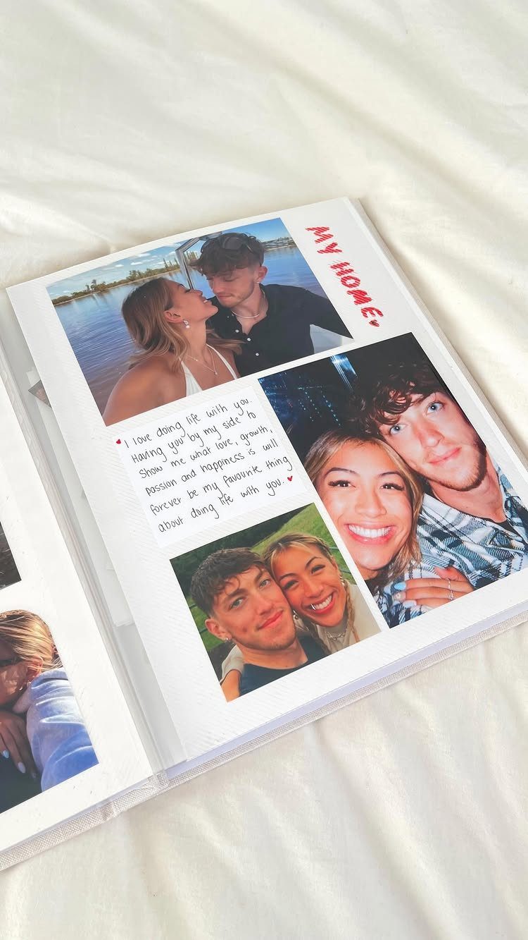 Open scrapbook with photos of a couple and handwritten romantic notes on white pages.