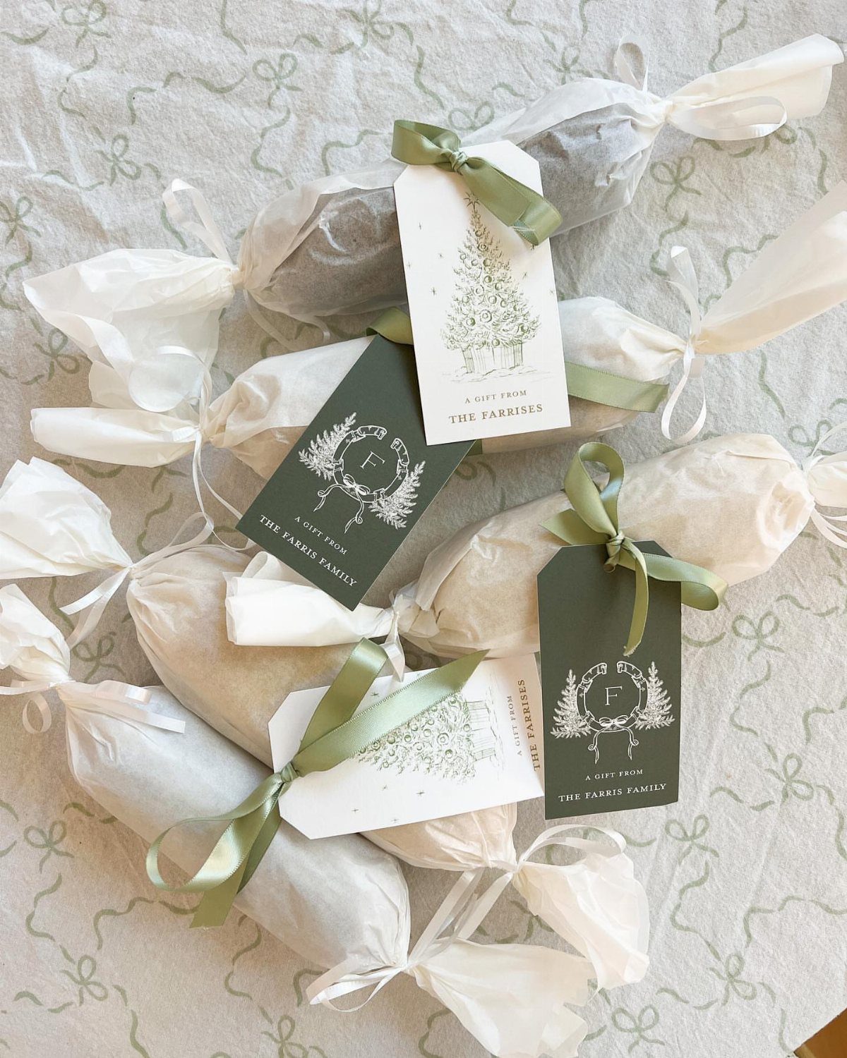 13 Easy Gifts for Neighbors You Can Make or Bake 8 Wrapped treats with olive green ribbons and decorative gift tags on a tablecloth