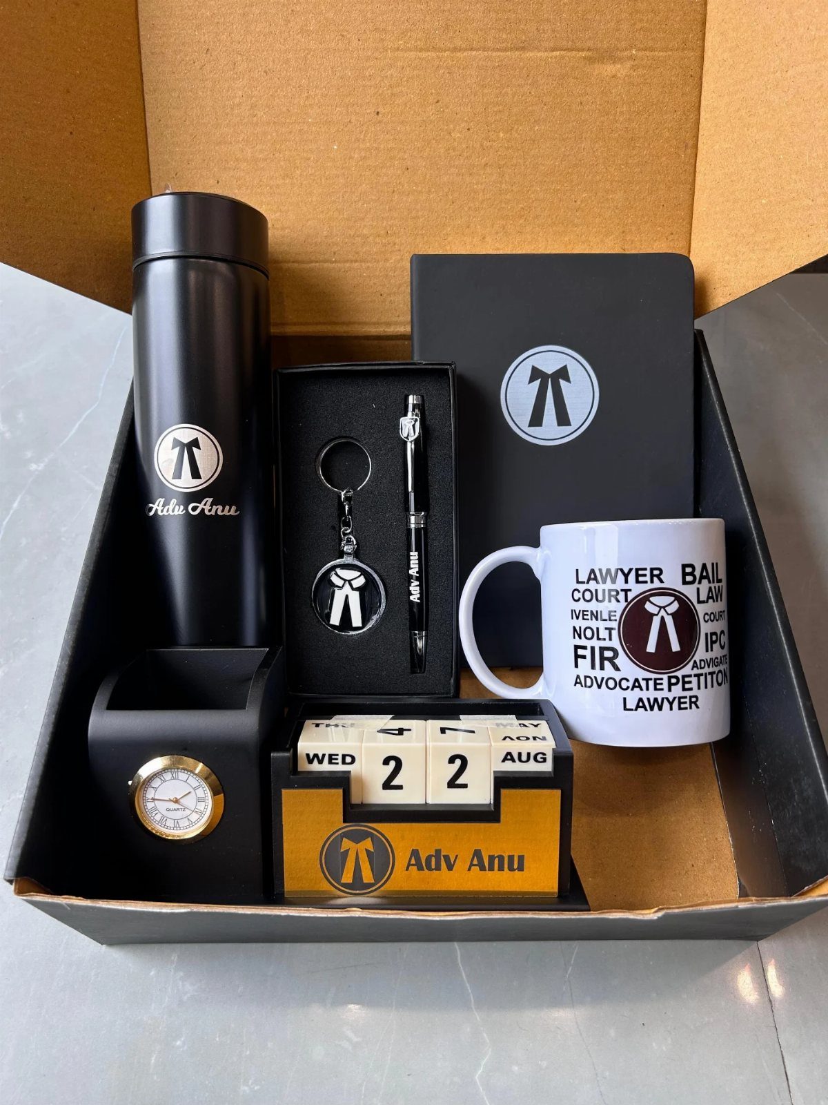 7 Father in Law Gift Ideas He'll Actually Use 1 Personalized lawyer gift set with black accessories and a white themed mug.