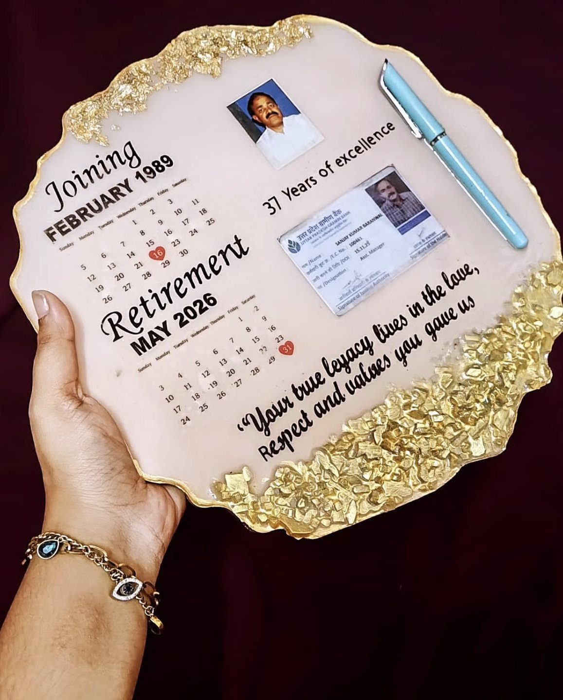 7 Father in Law Gift Ideas He'll Actually Use 3 Custom resin retirement plaque with photos, calendars, and gold foil edges held by hand.