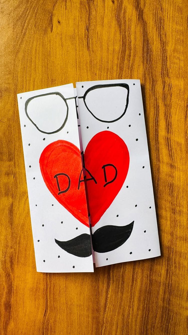 Handmade Father's Day card with glasses, a red heart, and a black mustache.