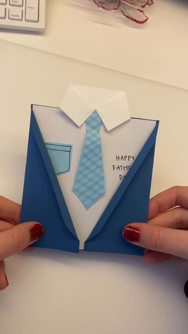 Handmade Father's Day card shaped like a blue suit with a blue tie.