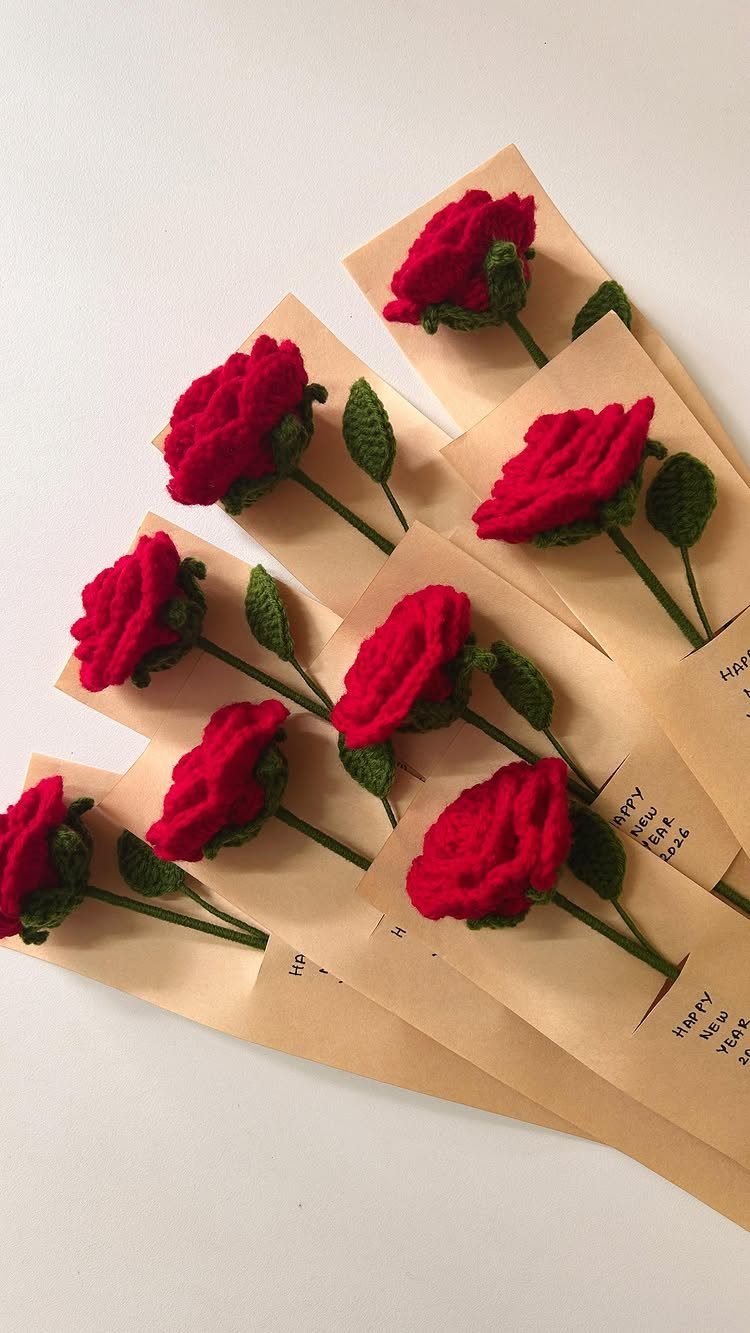 3 Free Gift Ideas With a Personal, Handmade Touch 3 Handmade crochet red roses with green stems tucked into brown paper envelopes.