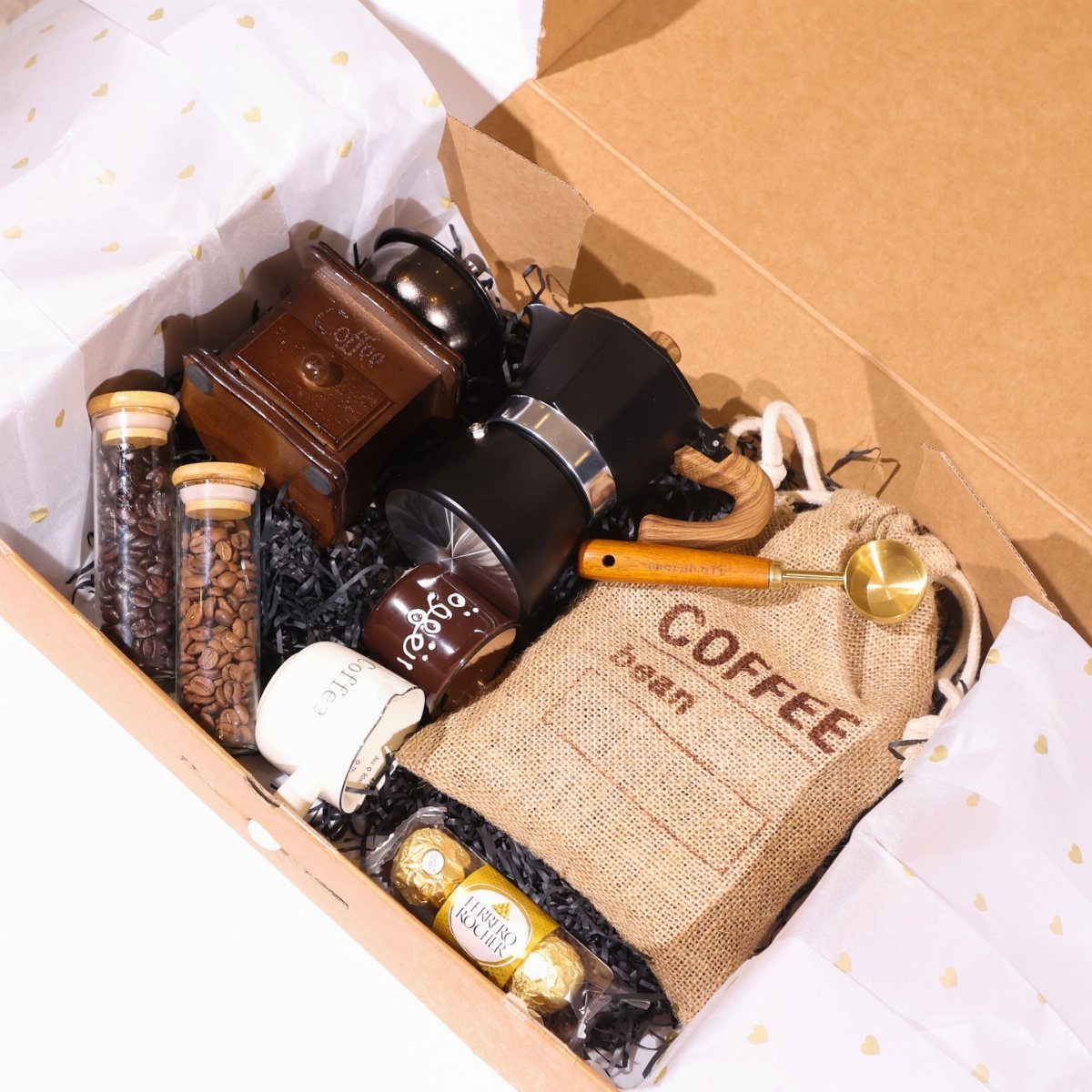 Coffee experience gift basket with grinder, French press, beans, and burlap bag.