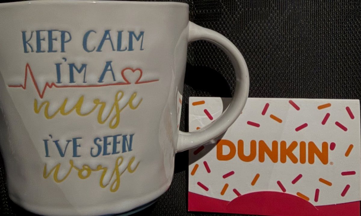 Nurse themed coffee mug and a Dunkin' gift card on a dark background.