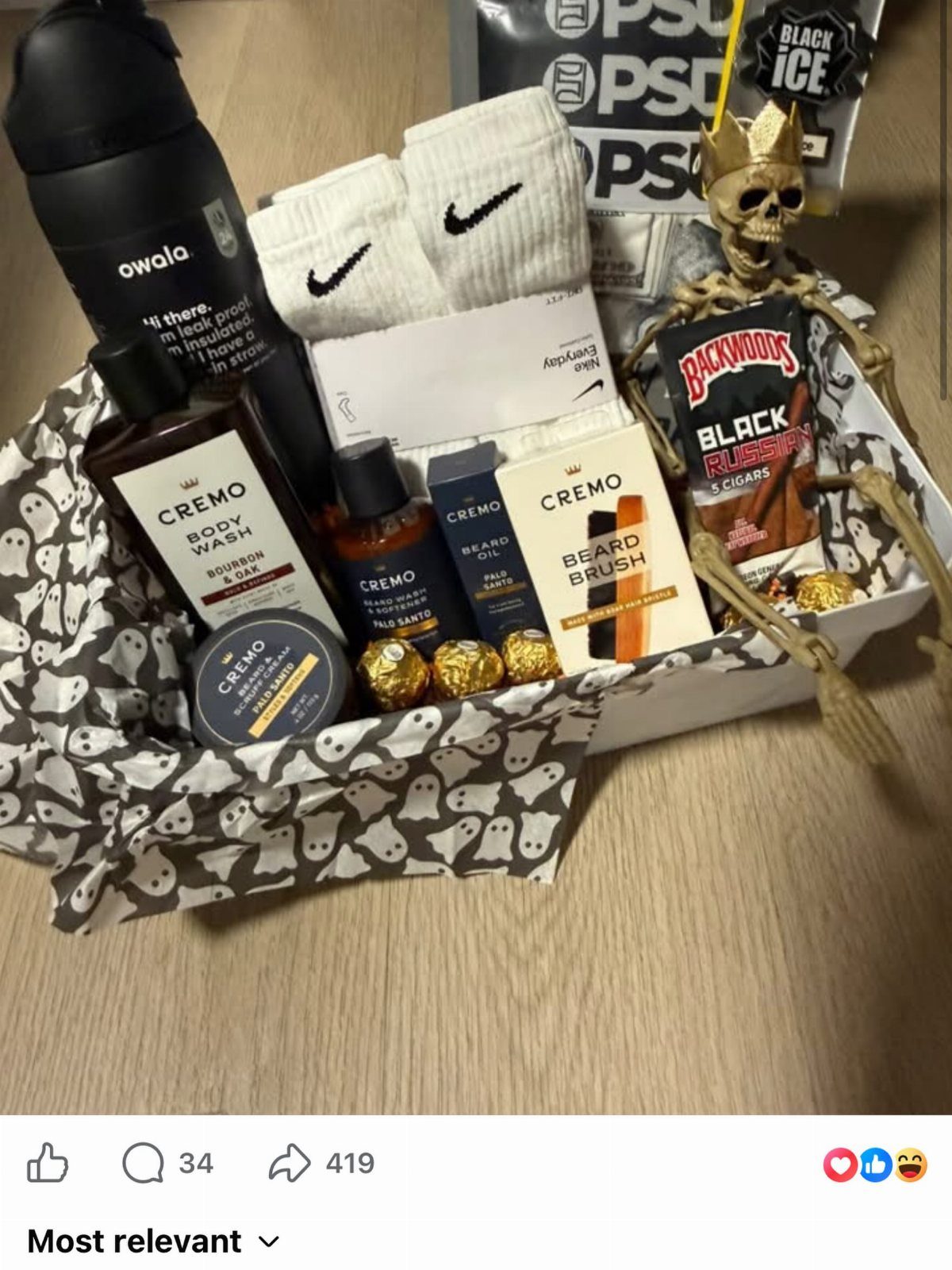 Grooming kit in a basket with beard care, socks, and a water bottle.