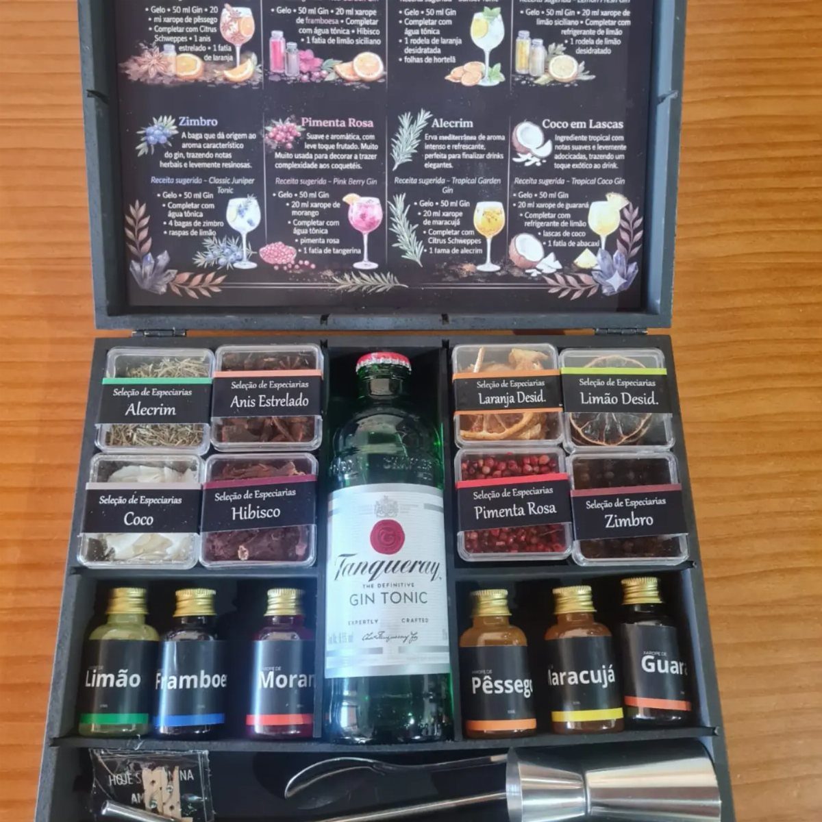 Gin tonic gift set with botanicals, syrups, and recipe guide in black box