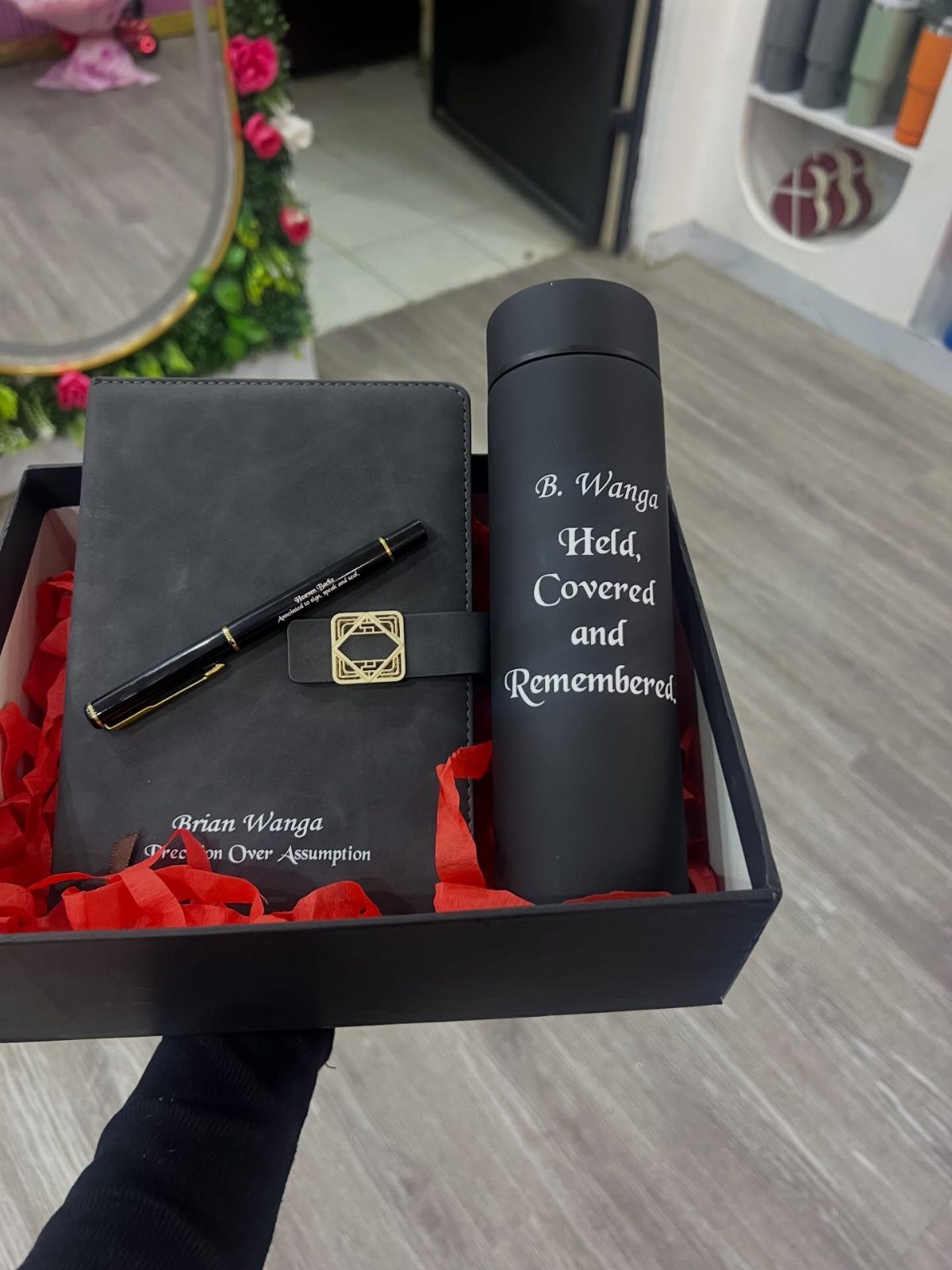 Personalized black gift set with notebook, pen, and thermos in a black box