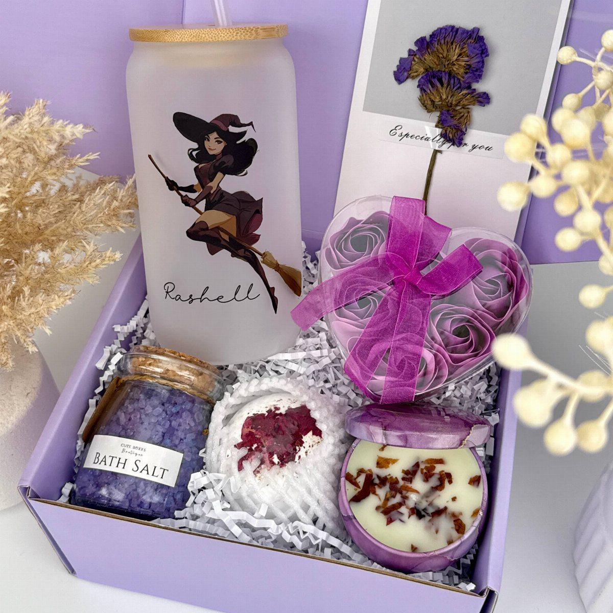Purple gift box with witch tumbler, bath salts, bath bomb, and soap roses.