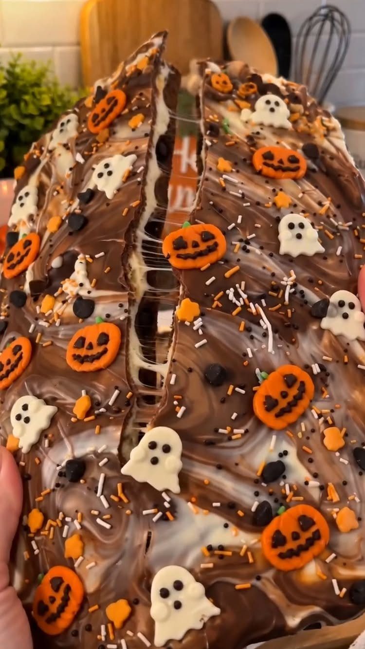 Halloween Food Gifts: 16 Sweet and Spooky Ideas 8 Chocolate bark with pumpkin and ghost candies, orange sprinkles, and chocolate chips.
