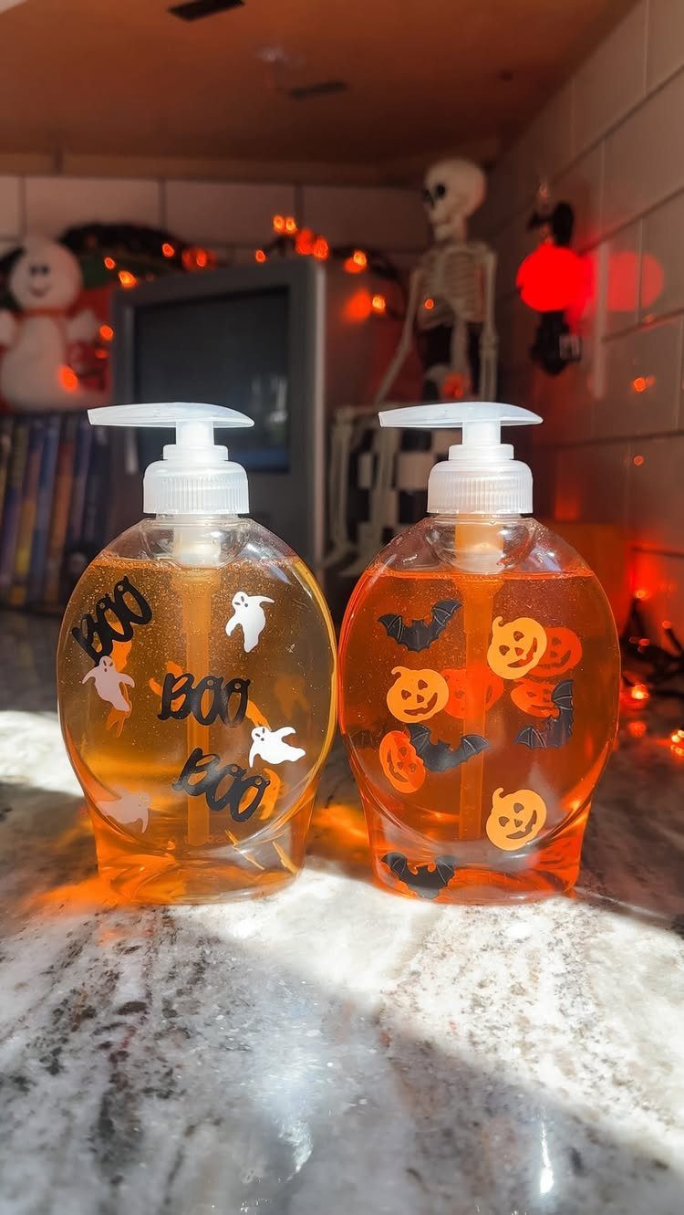 Halloween Teacher Gifts: 10 Ideas Teachers Will Like 1 Two orange liquid hand soap bottles decorated with Halloween ghost and pumpkin stickers.