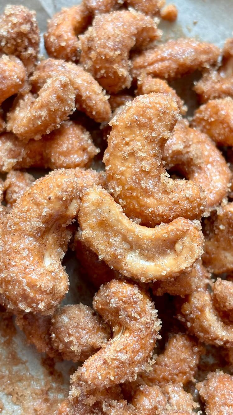 13 Homemade Gift Ideas for Coworkers They'll Use 12 Candied cashew nuts coated in cinnamon sugar piled on a baking sheet.
