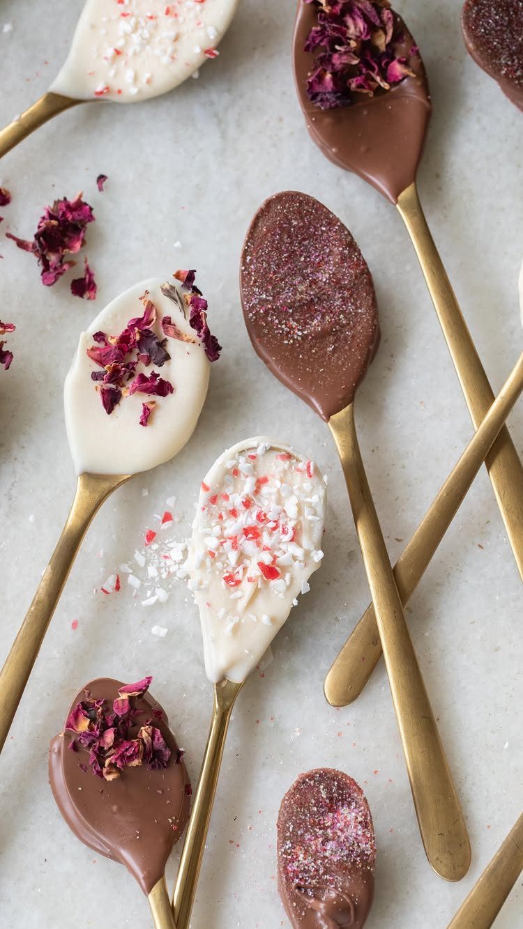 13 Homemade Gift Ideas for Coworkers They'll Use 13 Chocolate covered gold spoons topped with dried rose petals and peppermint on marble.