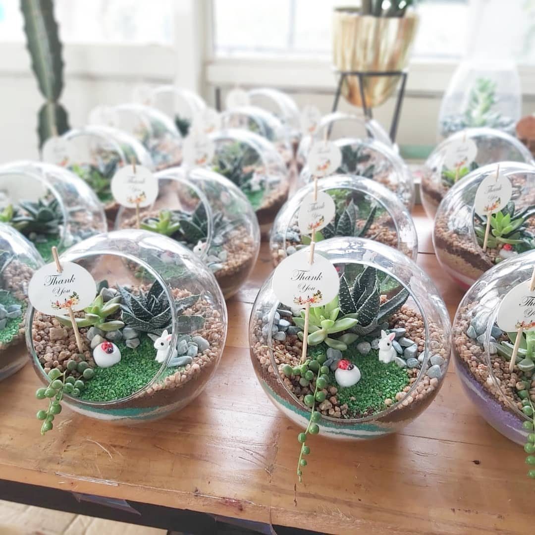 13 Homemade Gift Ideas for Coworkers They'll Use 10 Small glass sphere terrariums with succulents and thank you tags on a wooden table