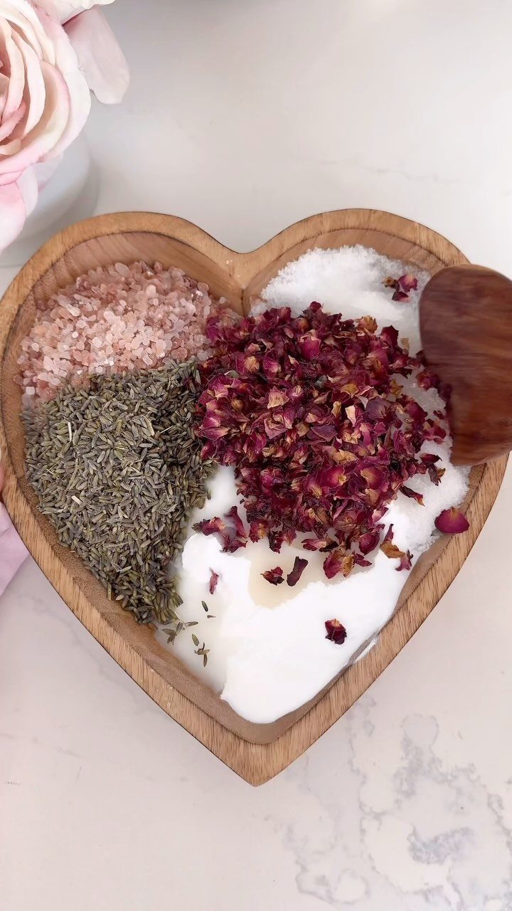 13 Homemade Gift Ideas for Coworkers They'll Use 6 Heart-shaped wooden bowl filled with pink salt, white salt, dried herbs, and rose petals.