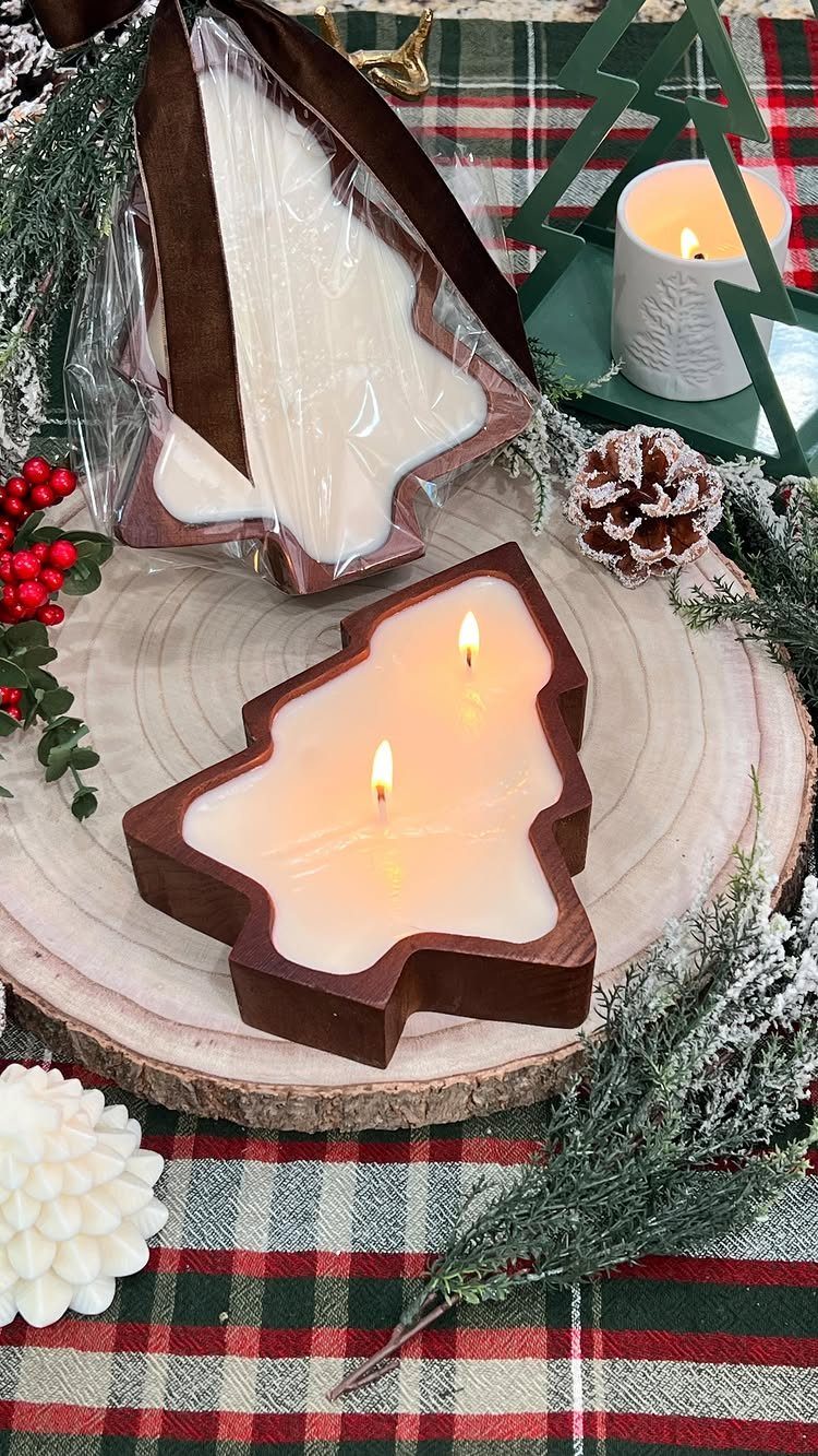 13 Homemade Gift Ideas for Coworkers They'll Use 4 Tree-shaped candles in wooden holders on a rustic wooden slice with winter greenery.