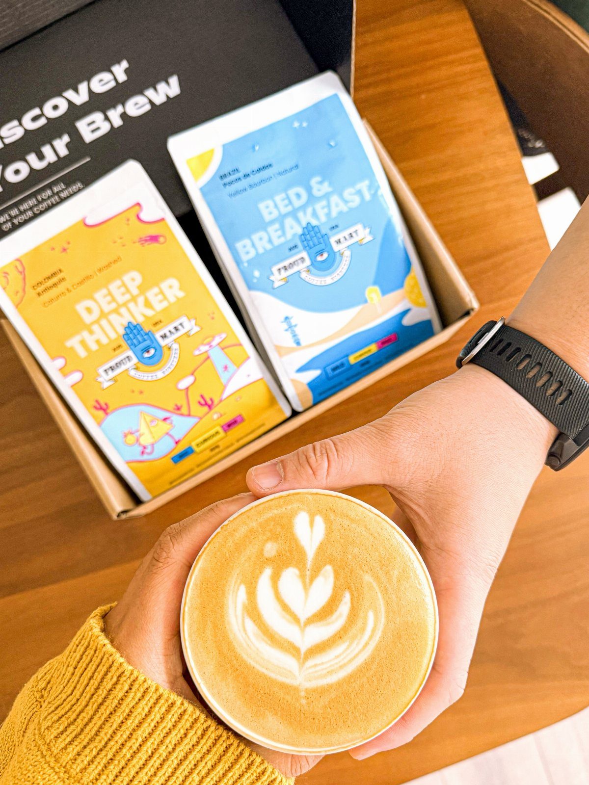 6 Last Minute Birthday Gifts for Dad He'll Actually Use 4 Latte with foam art held in front of a coffee gift set box.