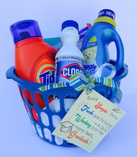 Blue laundry basket filled with detergent and bleach with a graduation gift card.