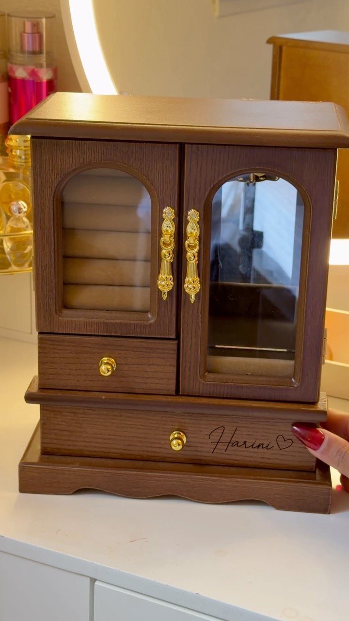 11 Mother in Law Birthday Gift Ideas She Will Actually Use 6 Brown wooden jewelry box with gold handles and personalized name on the drawer.