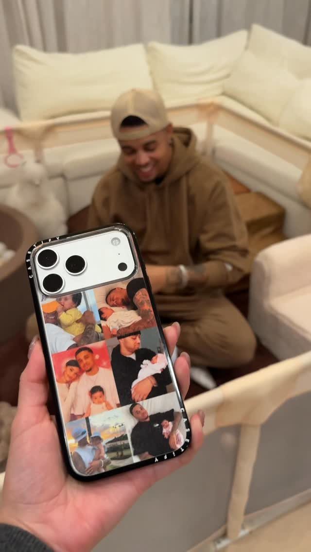 Personalized phone case with family photo collage held in front of a man.