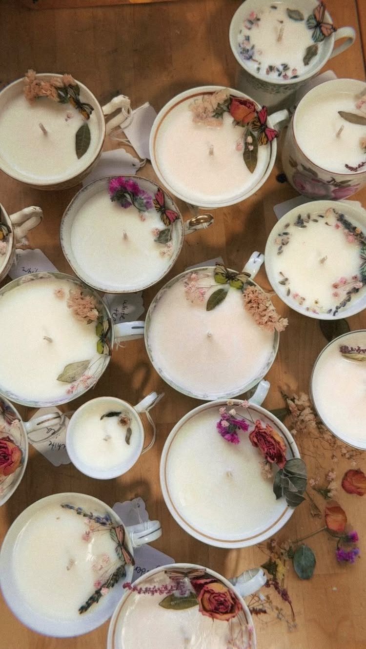 18 Mothers Day Gifts to Make: Easy Handmade Ideas for Mom 6 White candles in ceramic teacups decorated with dried flowers on a wooden surface.