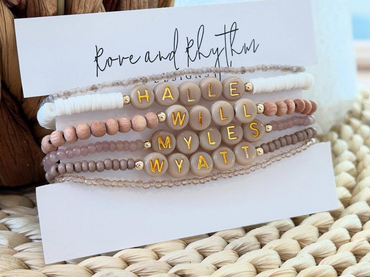 18 Mothers Day Gifts to Make: Easy Handmade Ideas for Mom 4 Four beaded bracelets with gold name letters on a white display card.