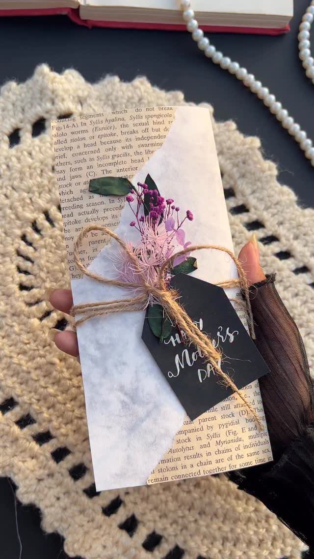 18 Mothers Day Gifts to Make: Easy Handmade Ideas for Mom 1 Handmade Mother's Day card with marbled paper, twine, and small purple flowers.