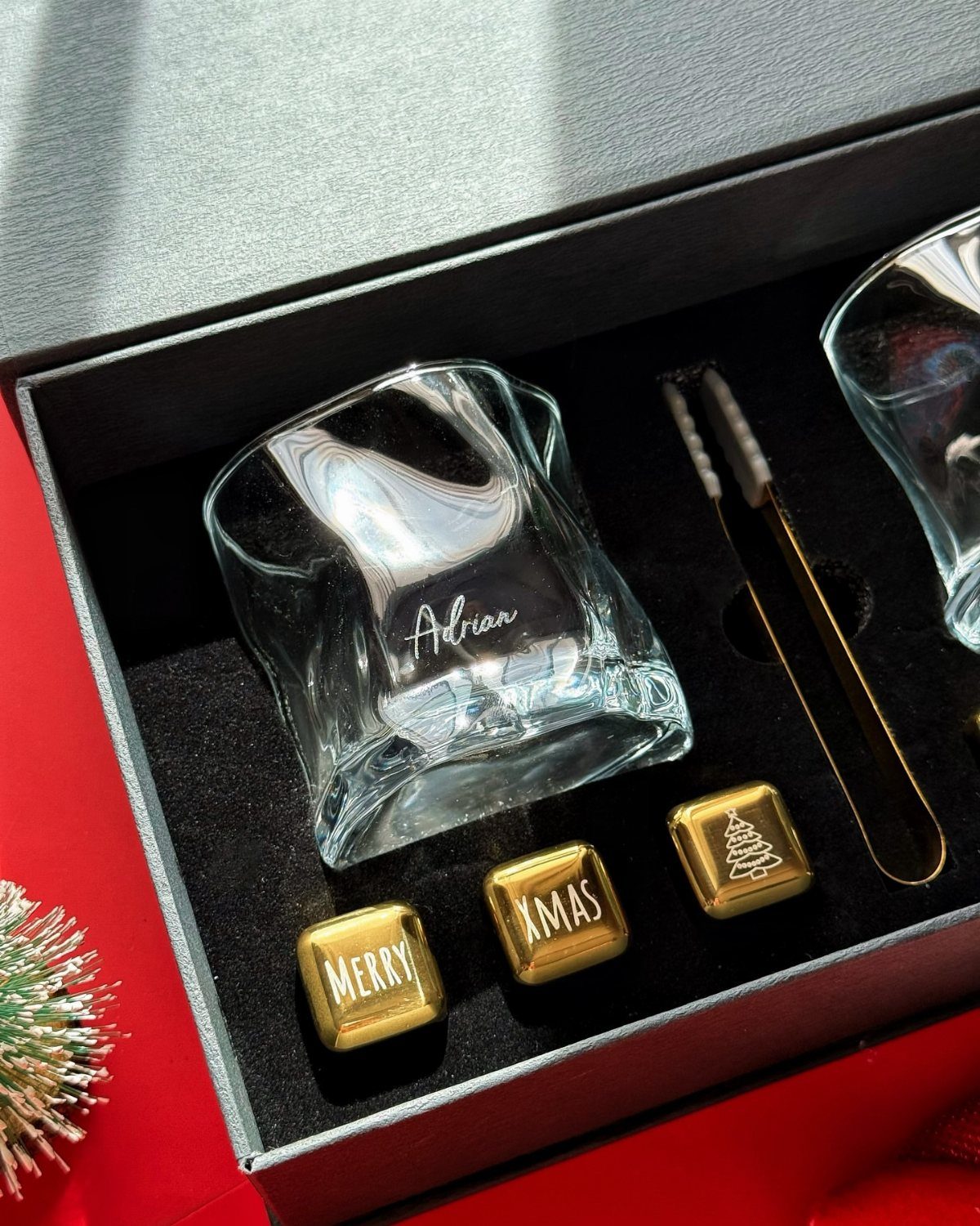 Engraved glass and gold Christmas ice cubes in a black gift box