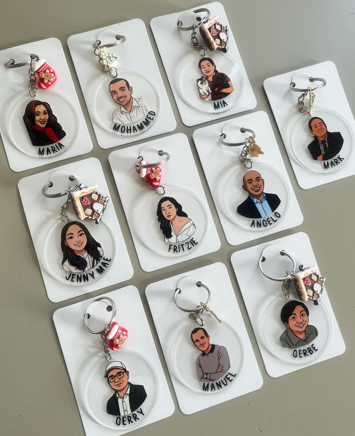 17 Personalized Gifts for Friends: Ideas for Every Budget 6 Circular acrylic keychains with cartoon portraits and names on white display cards.