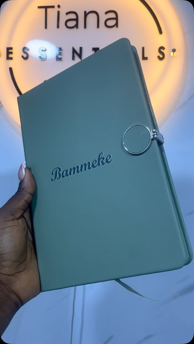 17 Personalized Gifts for Friends: Ideas for Every Budget 17 Sage green personalized notebook with the name Bammeke embossed on the cover.