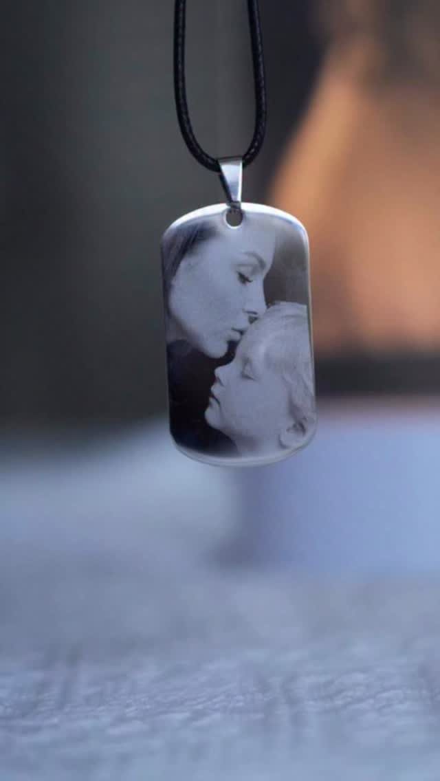 17 Personalized Gifts for Friends: Ideas for Every Budget 4 Silver dog-tag necklace pendant engraved with a black and white photo of a couple.