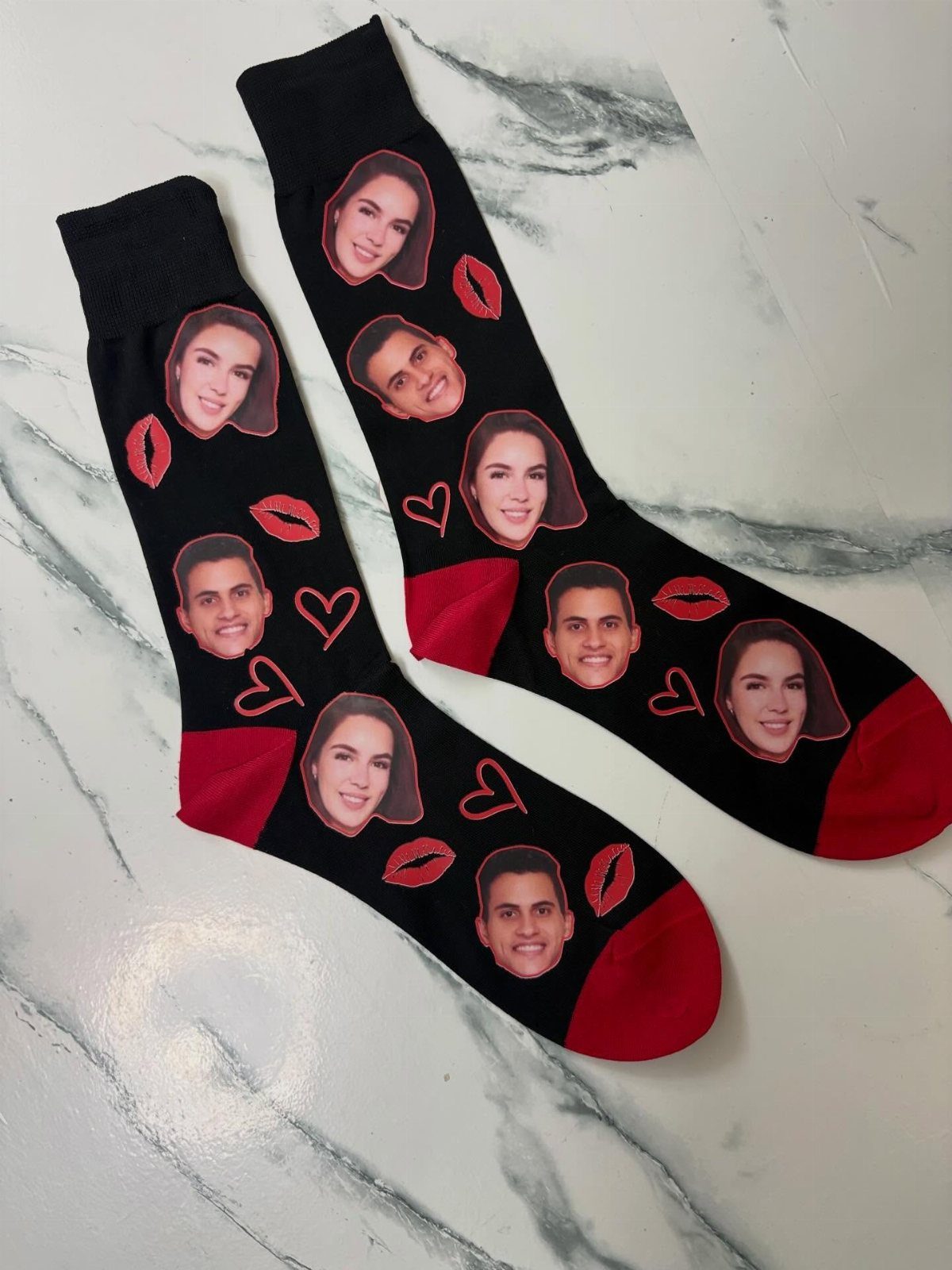 17 Personalized Gifts for Friends: Ideas for Every Budget 2 Black socks with printed faces of a couple, red hearts, and lips.