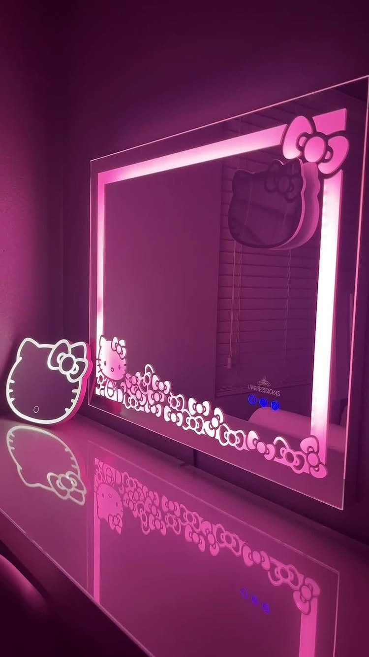 24 Pink Christmas Gift Ideas from Cozy to Glam 20 Pink glowing Hello Kitty mirror and small matching light on a reflective surface