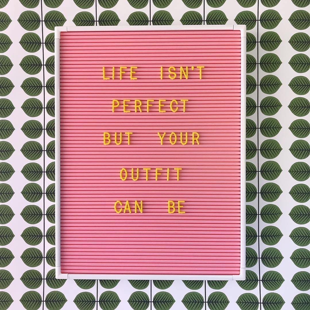 24 Pink Christmas Gift Ideas from Cozy to Glam 9 Pink felt letter board with yellow text on a green leaf pattern background