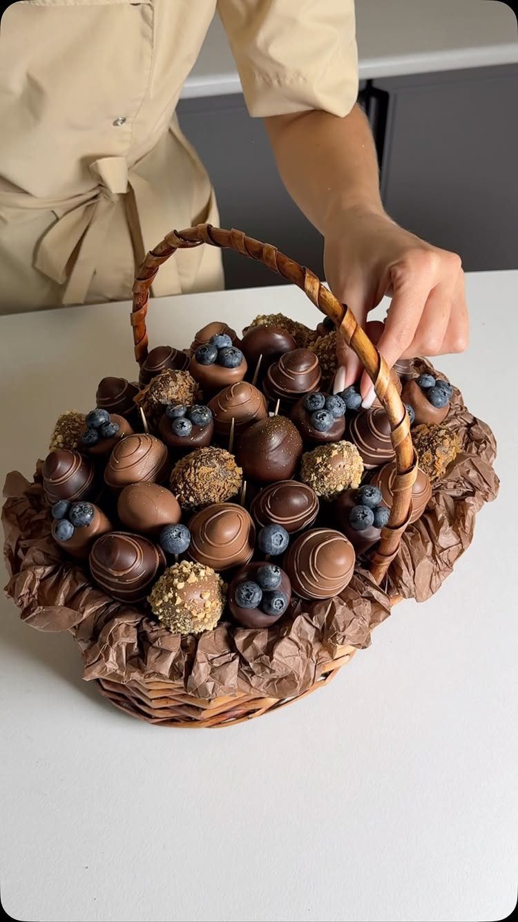 12 Silent Auction Gift Basket Ideas for Any Fundraiser 12 Wicker basket filled with assorted gourmet chocolate truffles and fresh blueberries