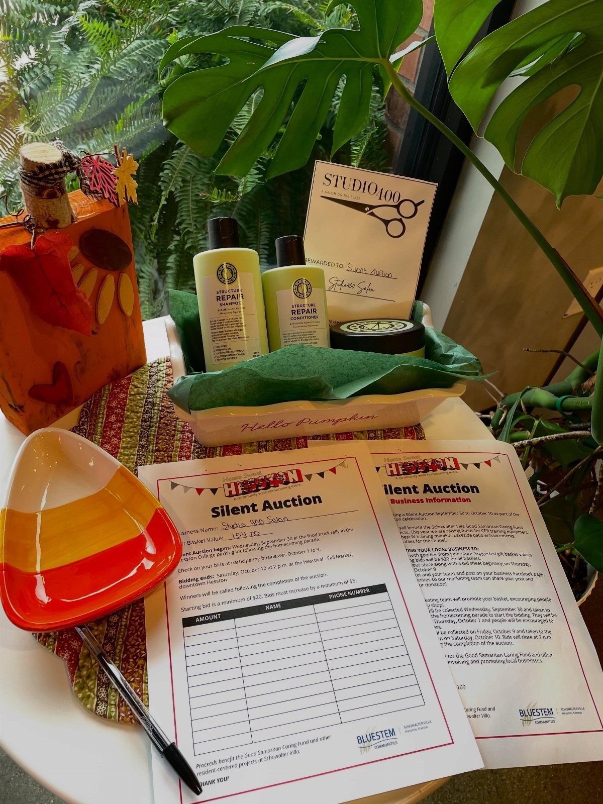 12 Silent Auction Gift Basket Ideas for Any Fundraiser 2 Spa gift basket with lotions and cream next to a silent auction bid sheet.