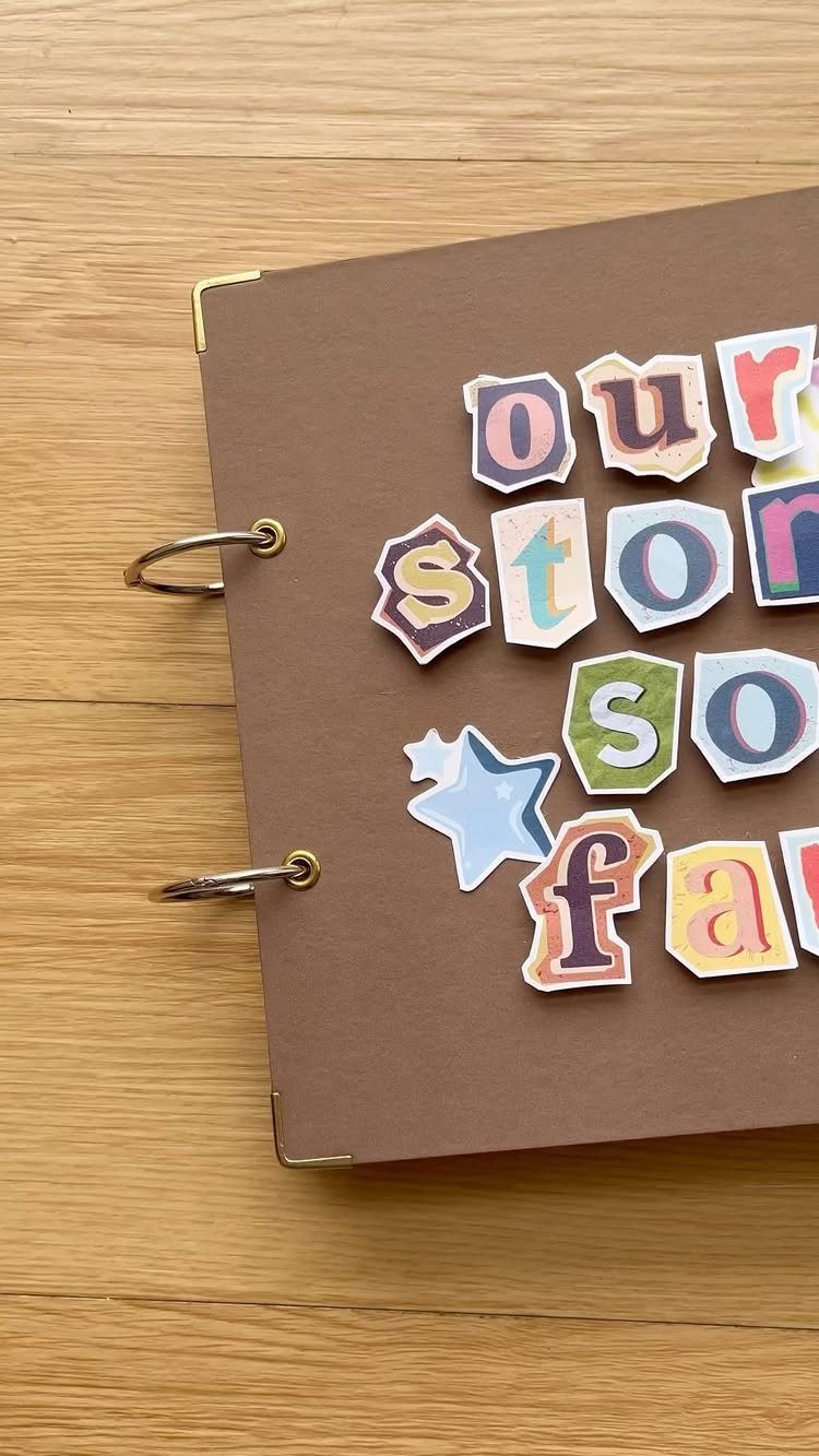 8 Small Gifts for Family That Everyone Will Enjoy 6 Brown ring-bound scrapbook with colorful cutout letters spelling our story so far