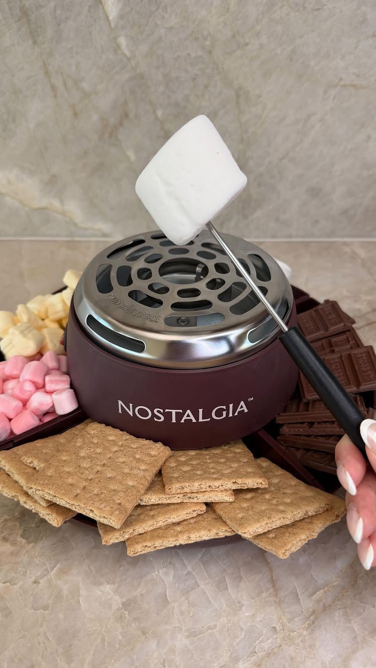 8 Small Gifts for Family That Everyone Will Enjoy 5 Electric s'mores maker roasting a marshmallow surrounded by graham crackers and chocolate.